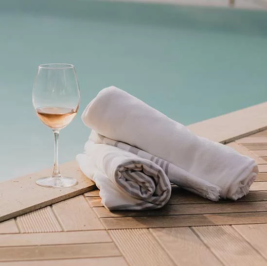 Towels and Wineglass at Swimming Pool Towels and Wineglass at Swimming Pool